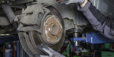 Photo of Someone Repairing a Vehicle