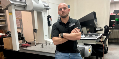 Photo of Leonard Machine Purchasing Manager with Equipment